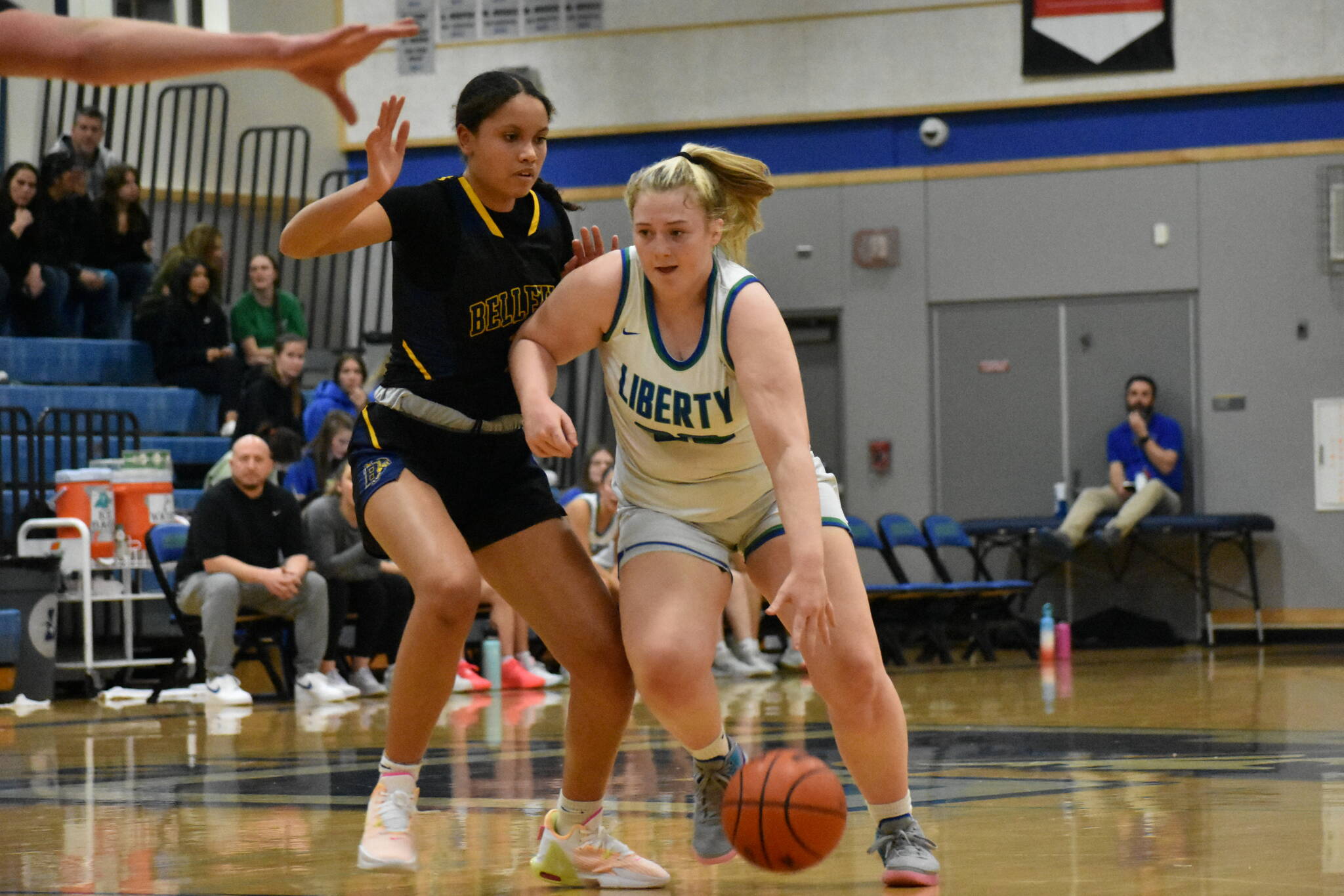 Ella Whitaker looks to go past a Wolverine defender. Ben Ray / The Reporter