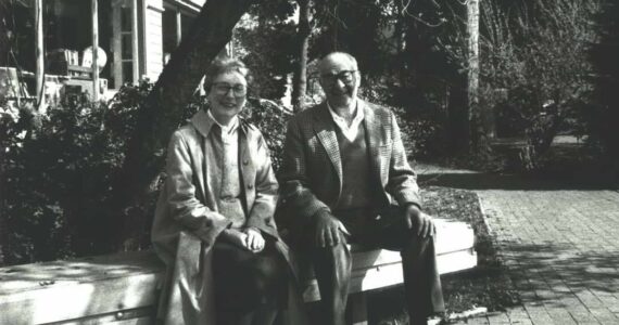 Ruth and Marvin Mohl sit on a bench in Gilman Village. The Village, which once held 27 shops, now holds over 40. (Photo courtesy of the Gilman Village)