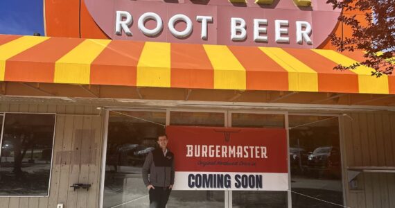 Alex Jensen, CEO and owner of Burgermaster, stands next to the prospective sixth Burgermaster location. (Photo by Cameron Sires/Sound Publishing)