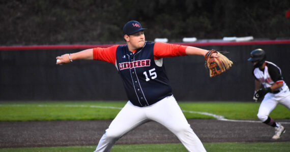 Kyle Burris takes to the mound against Sammamish at Bannerwood Park. Ben Ray / The Reporter