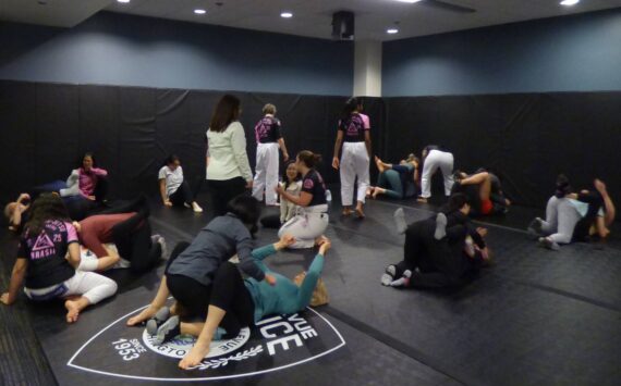 Instructors walk around to support and assist women. (Cameron Sires/ Sound Publishing)