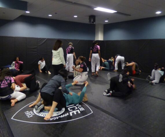 Instructors walk around to support and assist women. (Cameron Sires/ Sound Publishing)