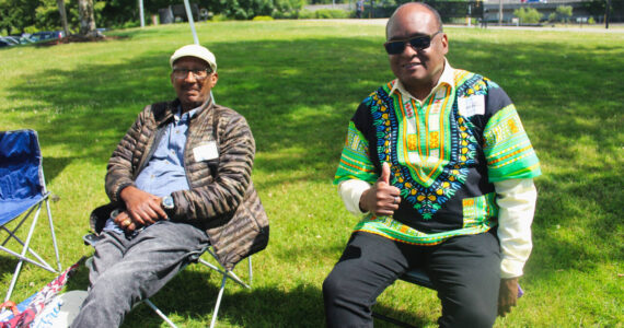 Volunteers enjoy the sunshine at Renton’s 2024 Juneteenth Celebration. The weather will be sunny this weekend as summer officially starts. Photo by Bailey Jo Josie/Sound Publishing