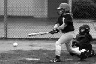 Issaquah Little League Tiger’s Sarah Jordan takes a swing Saturday afternoon.